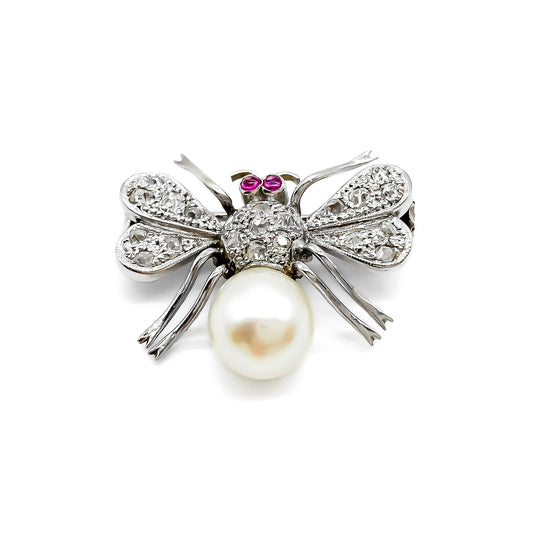 Dainty 18ct white gold insect brooch with diamonds on the wings and thorax, ruby eyes and a pearl abdomen. 