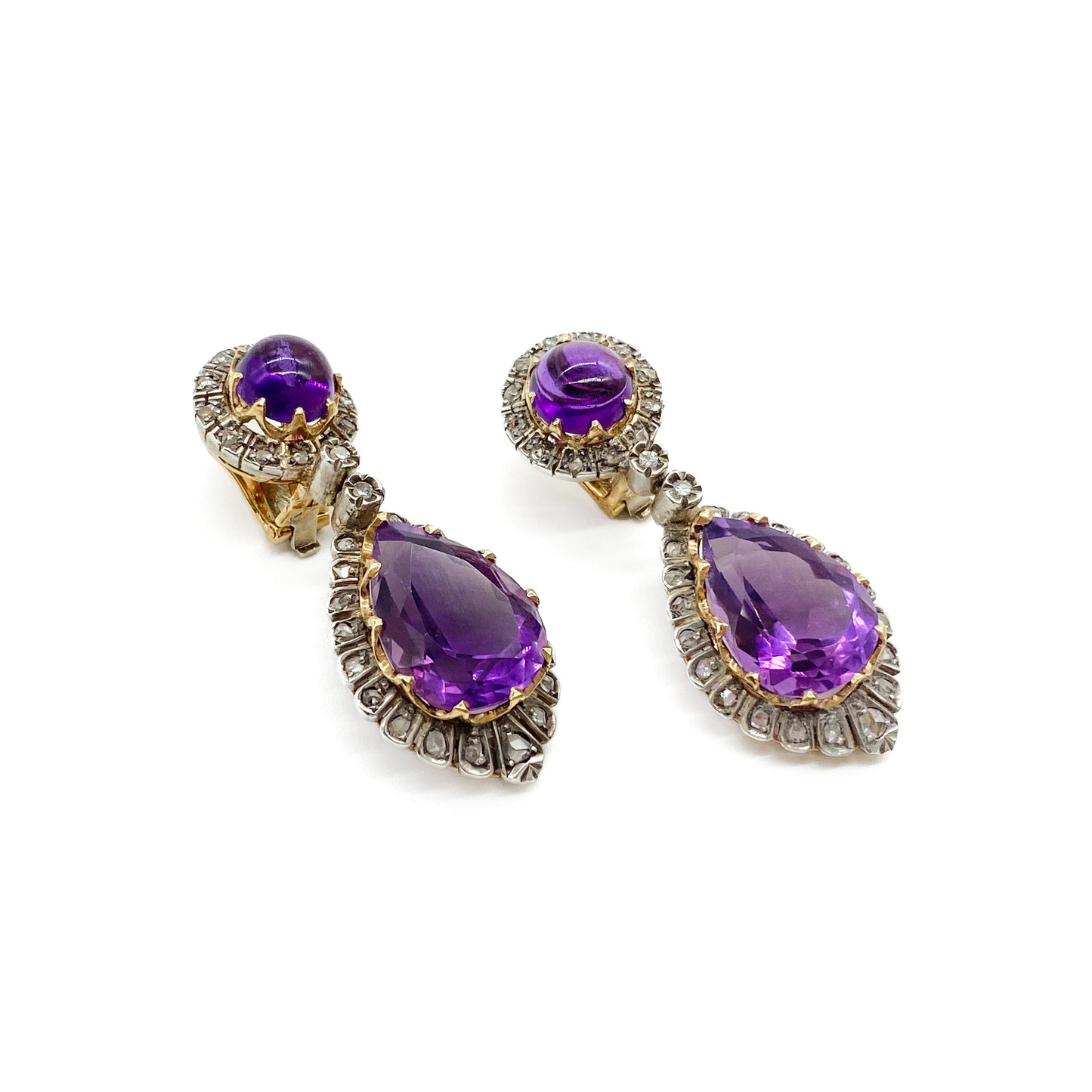 Magnificent antique 18ct yellow gold and silver articulated drop earrings, each set with a teardrop shaped faceted amethyst and a round cabochon amethyst, surrounded by thirty-one mine-cut diamonds and two old-cut diamonds.