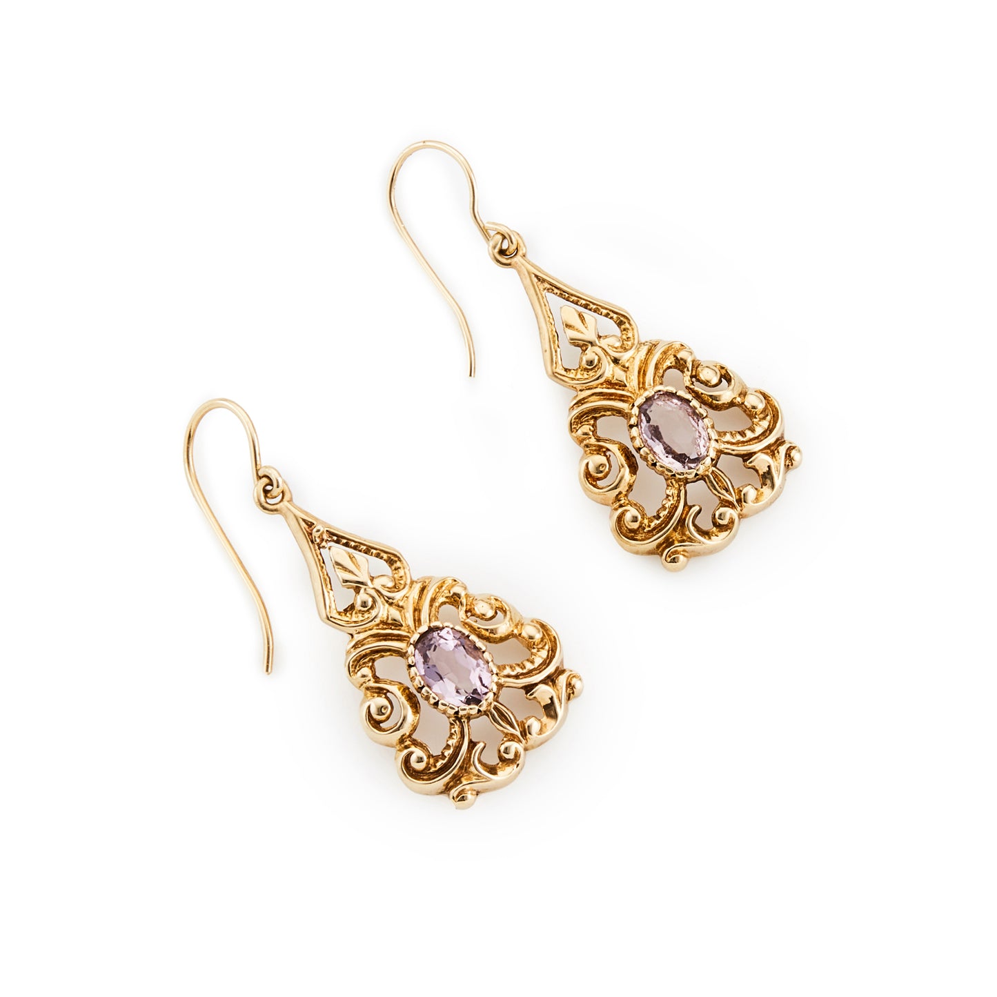 Lovely 9ct yellow gold ornate drop earrings, each set with a light-purple faceted oval amethyst. Circa 1940’s
