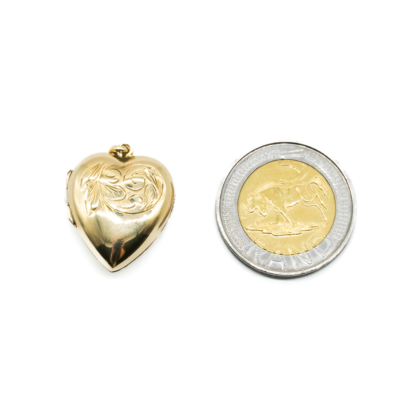 Lovely 9ct gold back and front beautifully engraved, heart shaped locket.