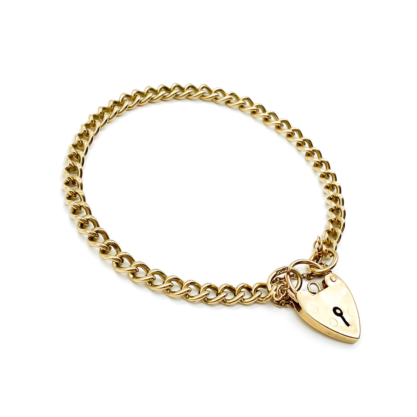 Classic 9ct yellow gold curb link bracelet with padlock. Safety chain attached. Circa 1940's