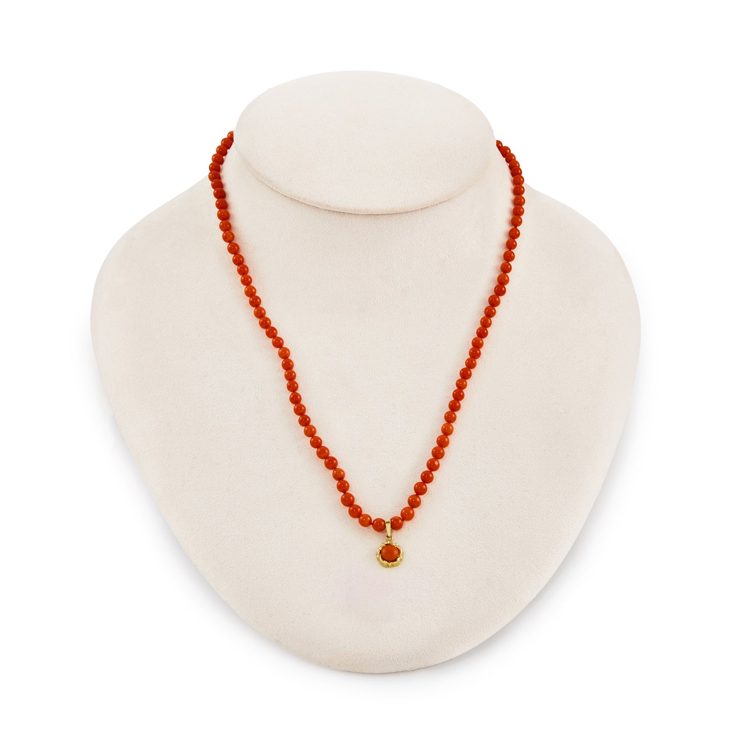 Natural red Mediterranean coral beads with a 9ct gold and coral pendant and a 9ct gold bolt ring clasp.