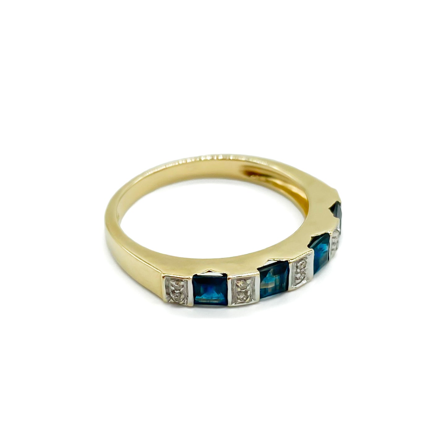 Classic vintage 9ct gold half eternity ring set with ten tiny diamonds and four natural, square sapphires. 