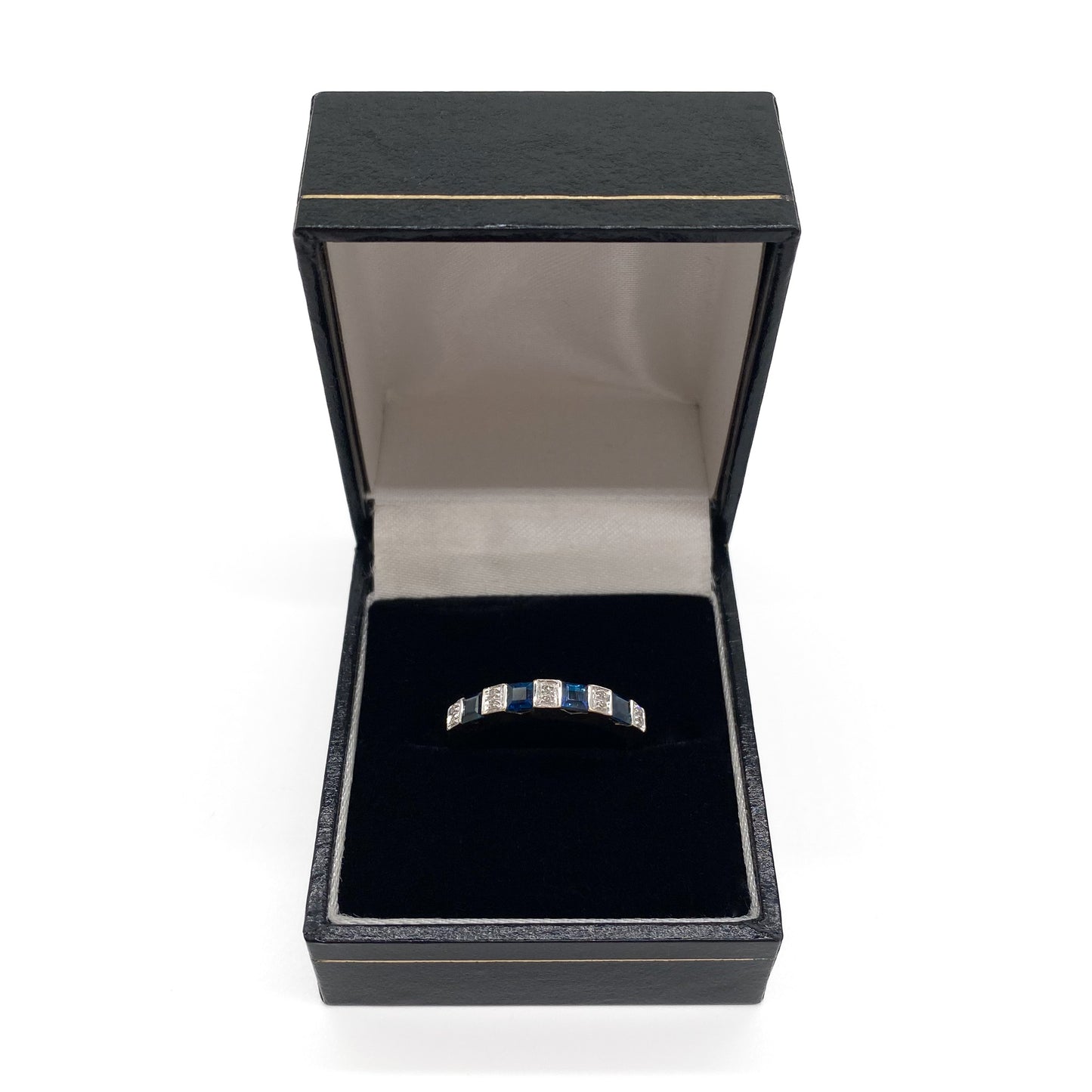Classic vintage 9ct gold half eternity ring set with ten tiny diamonds and four natural, square sapphires. 