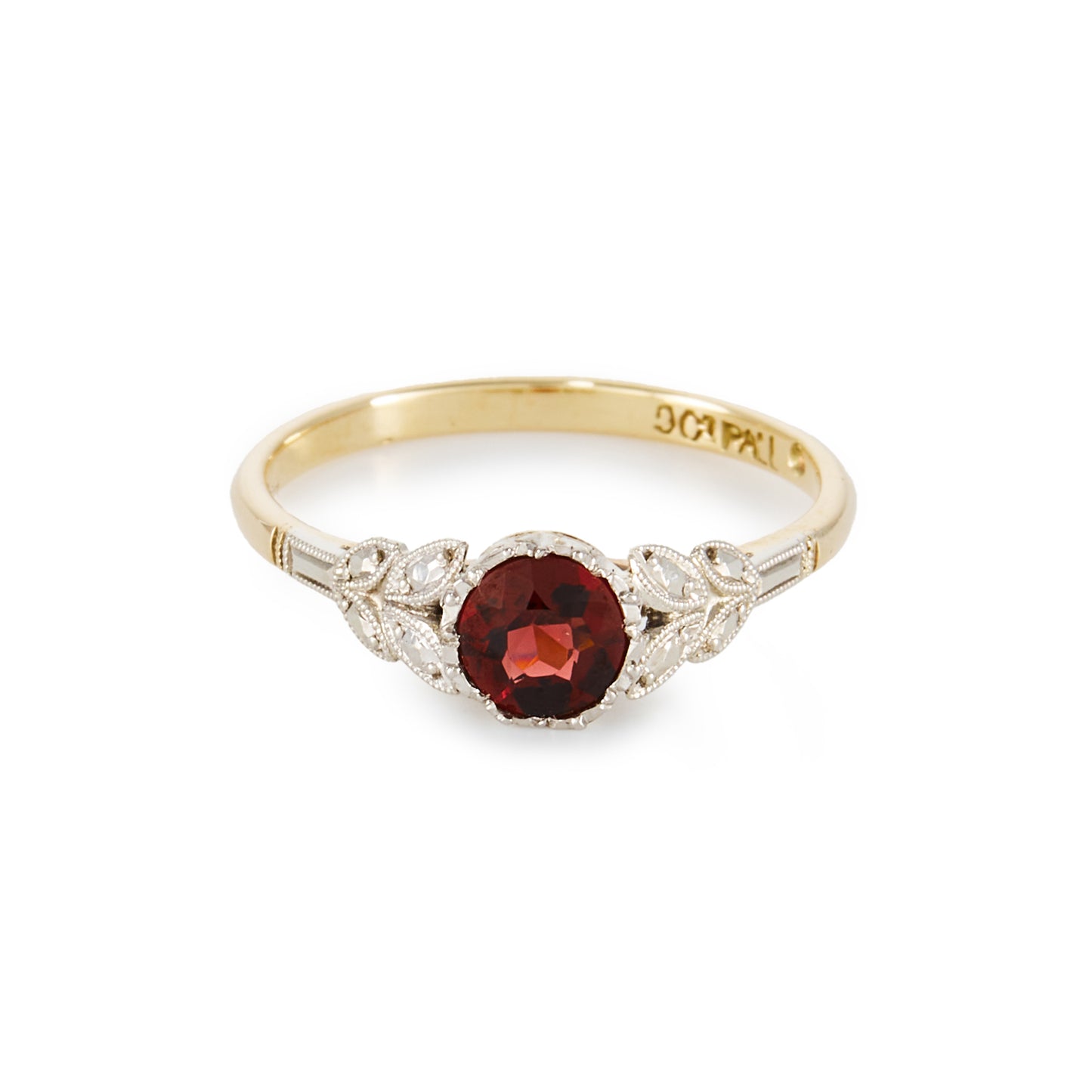 Pretty 9ct gold ring with a beautiful deep red garnet in a 9ct white gold setting with leaf detail, complemented by a yellow gold shank.