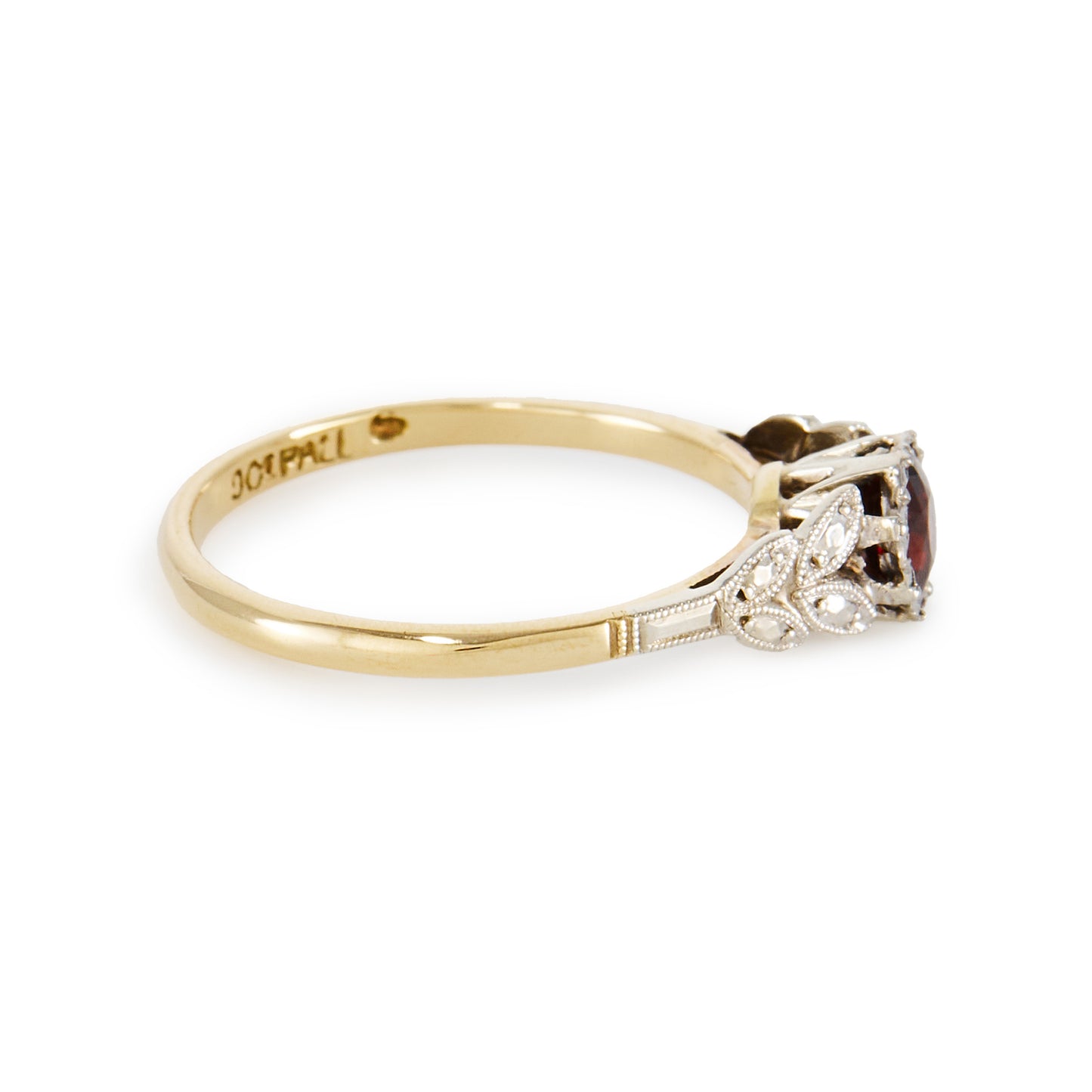 Pretty 9ct gold ring with a beautiful deep red garnet in a 9ct white gold setting with leaf detail, complemented by a yellow gold shank.