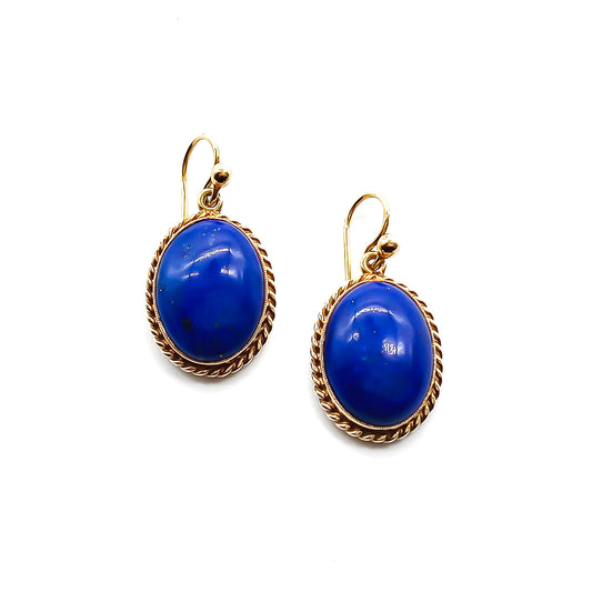 Lovely 9ct yellow gold earrings, each set with a deep blue lapis lazuli cabochon. Circa 1950’s