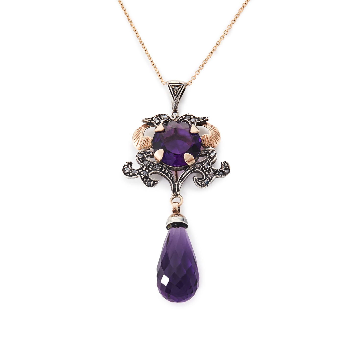 Magnificent 9ct gold and silver vintage pendant set with a round amethyst stone and eighteen mine cut diamonds. Enhanced with a beautifully faceted amethyst drop.