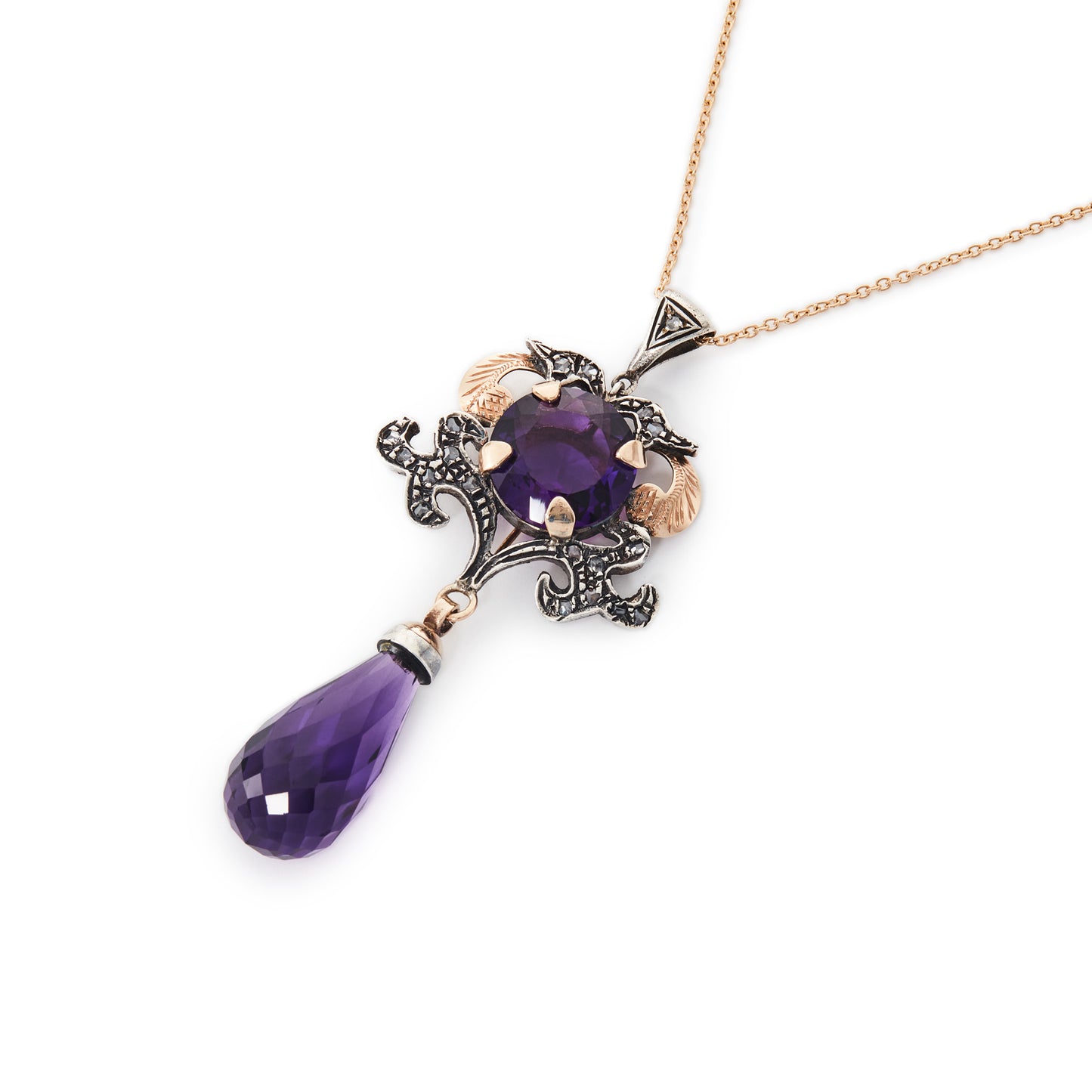 Magnificent 9ct gold and silver vintage pendant set with a round amethyst stone and eighteen mine cut diamonds. Enhanced with a beautifully faceted amethyst drop.