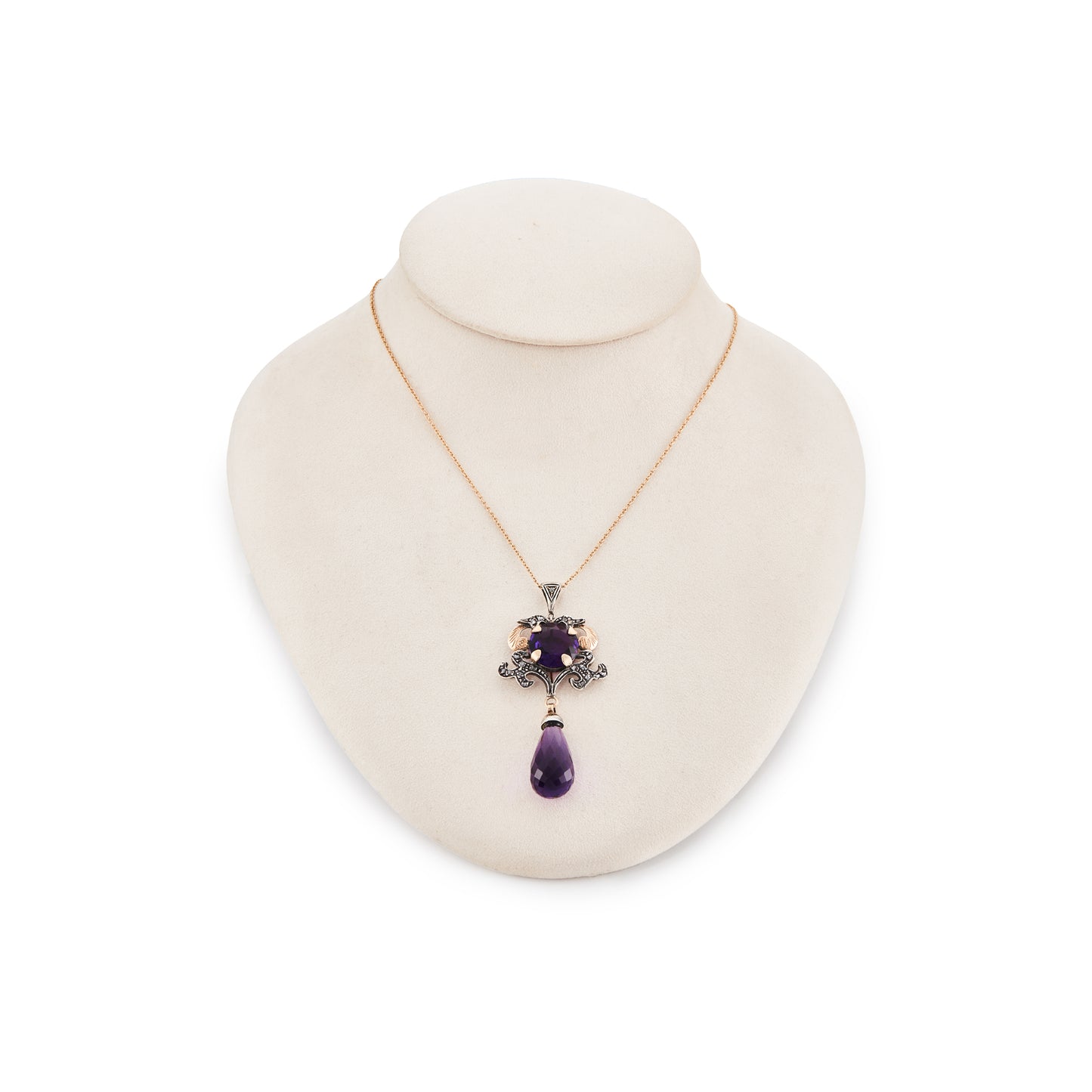Magnificent 9ct gold and silver vintage pendant set with a round amethyst stone and eighteen mine cut diamonds. Enhanced with a beautifully faceted amethyst drop.