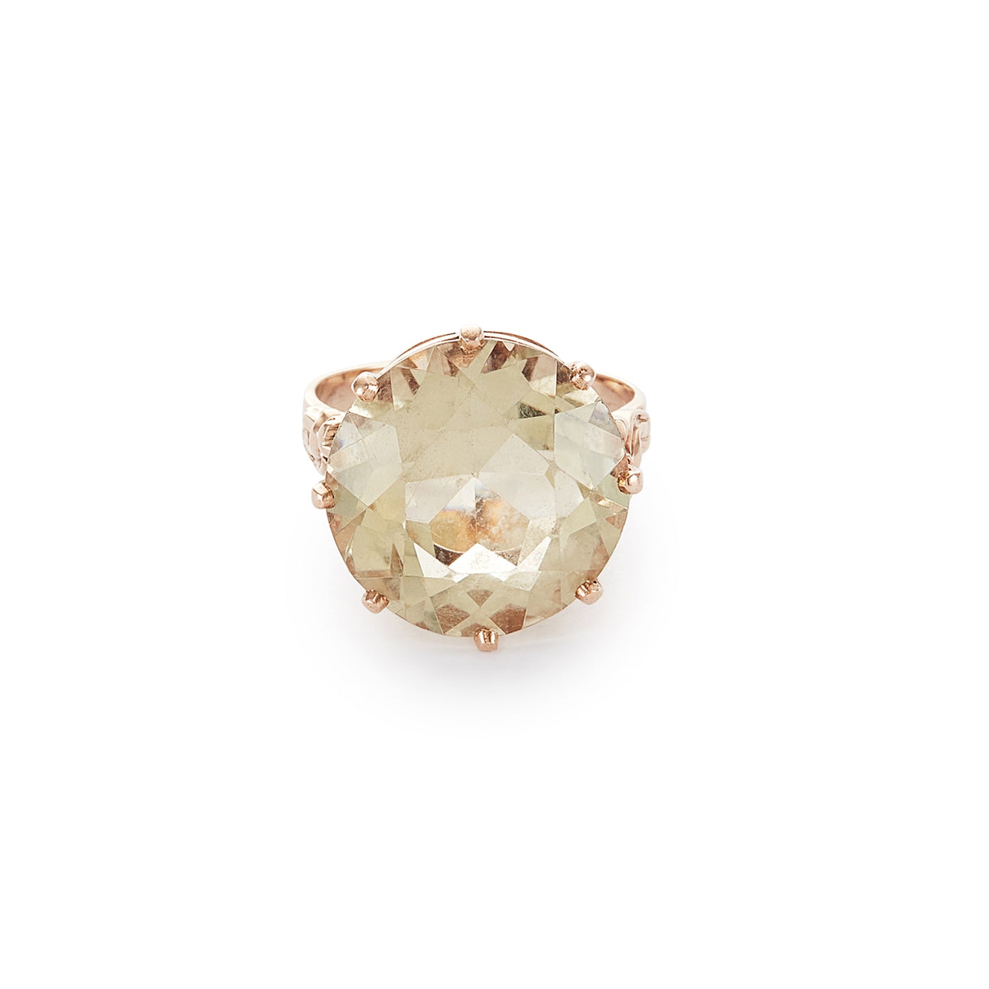 Stylish 9ct gold ring set with a light coloured citrine in an elevated claw setting. Ornate flower detail on the shoulders.