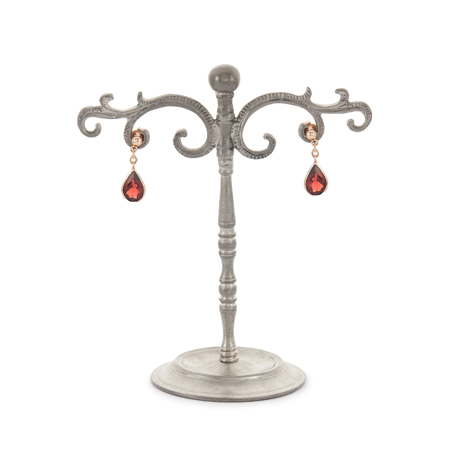 Vintage 9ct rose gold earrings, each set with a beautifully faceted teardrop-shaped garnet with a deep red hue.