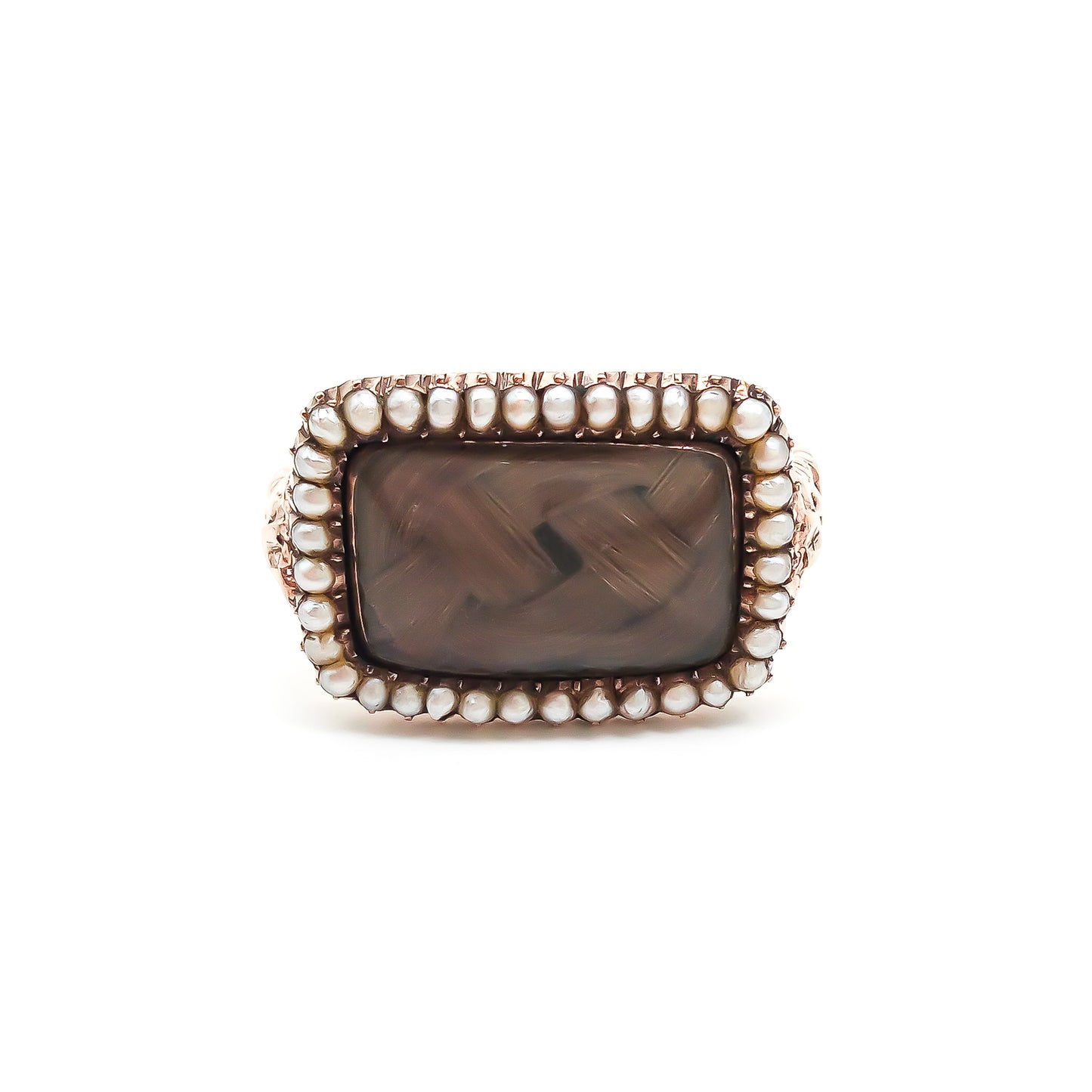 Beautifully crafted Georgian mourning ring in a 9ct rose gold setting with plaited hair under domed glass, adorned with tiny seed pearls. Later shank.