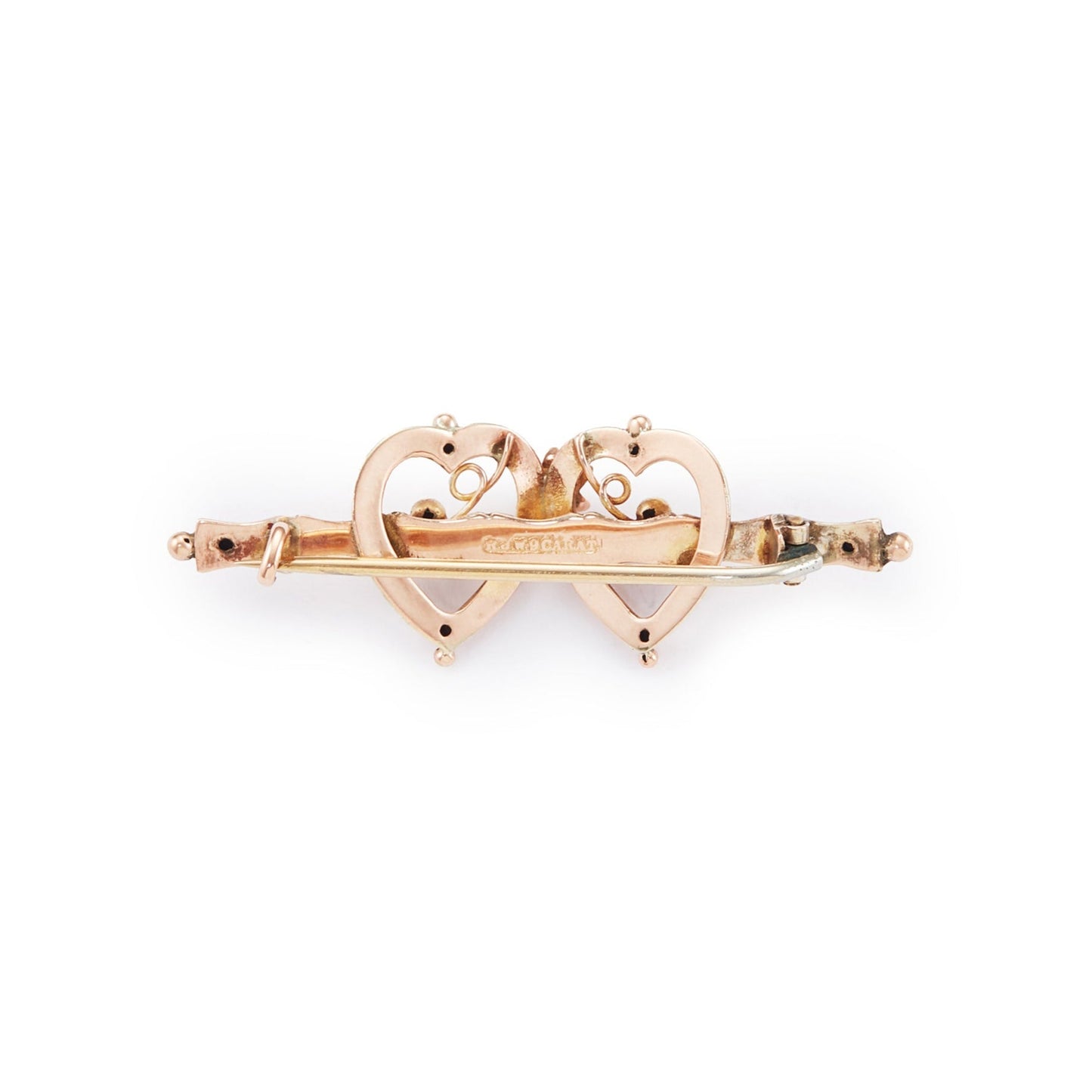Pretty Victorian 9ct rose gold brooch depicting two hearts with floral details.