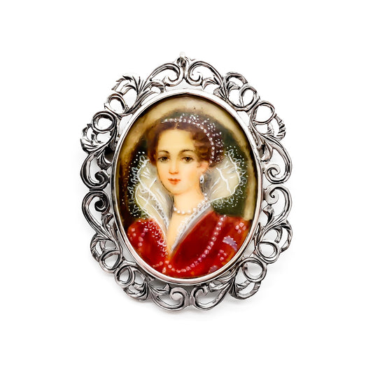 Beautiful antique European hand painted miniature set in an intricate silver (900) frame. Can be worn as a pendant or a brooch.