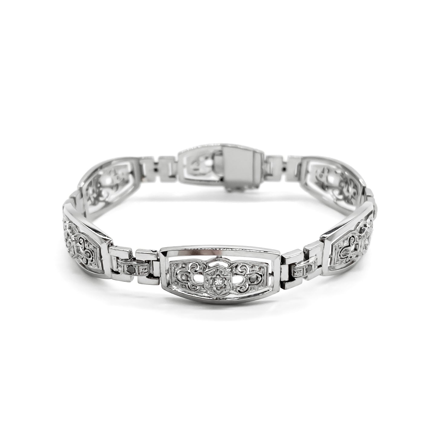 Stunning Art Deco 18ct white gold articulated bracelet set with six European-cut diamonds (0.05ct each) and eighteen tiny mine cut diamonds. Argentina