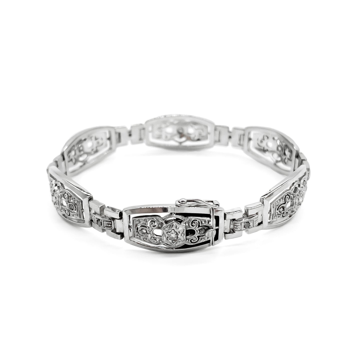 Stunning Art Deco 18ct white gold articulated bracelet set with six European-cut diamonds (0.05ct each) and eighteen tiny mine cut diamonds. Argentina