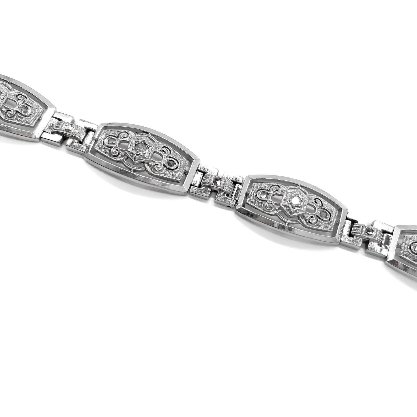 Stunning Art Deco 18ct white gold articulated bracelet set with six European-cut diamonds (0.05ct each) and eighteen tiny mine cut diamonds. Argentina