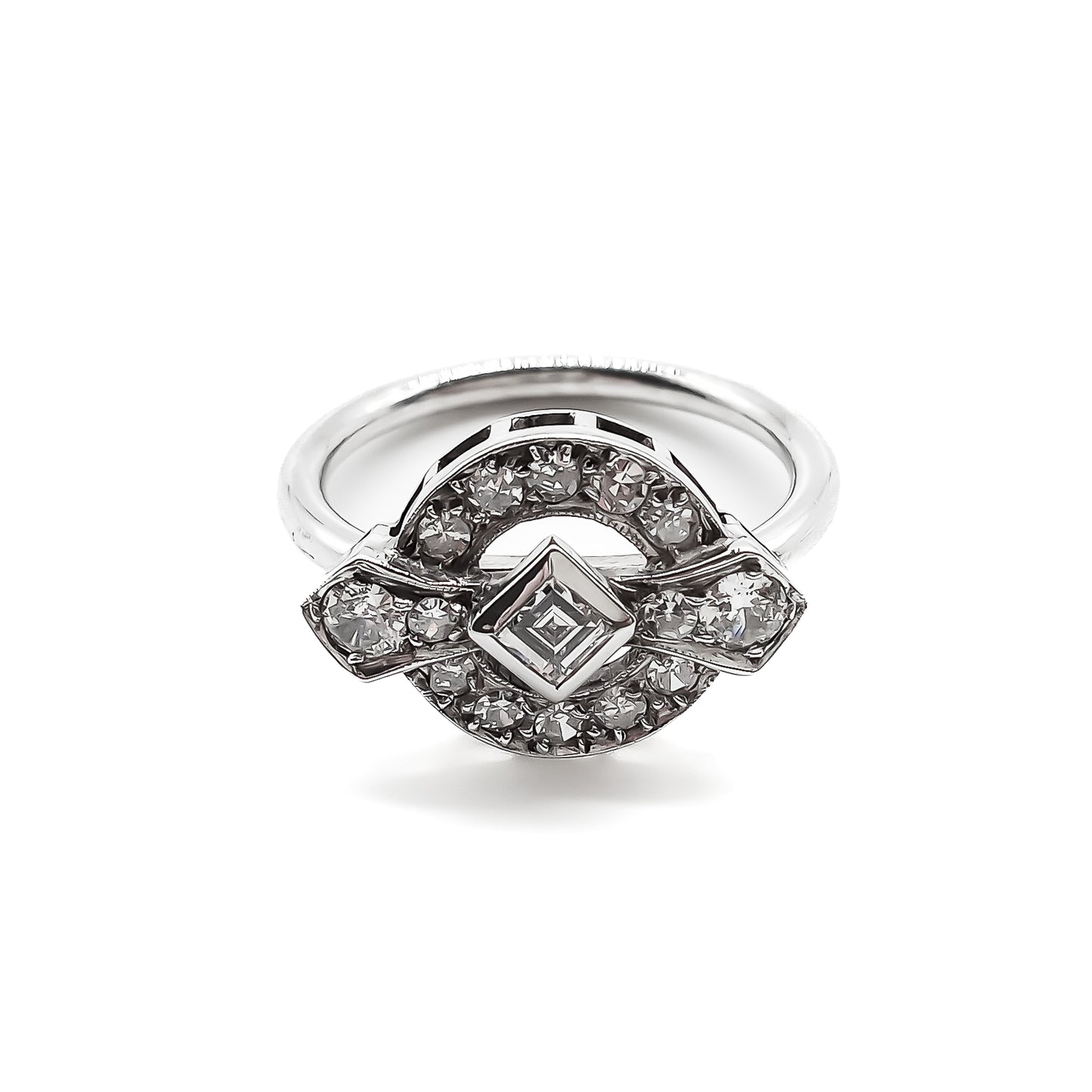 Stunning 18ct white gold Art Deco ring with a princess cut centre diamond and fourteen round cut diamonds.