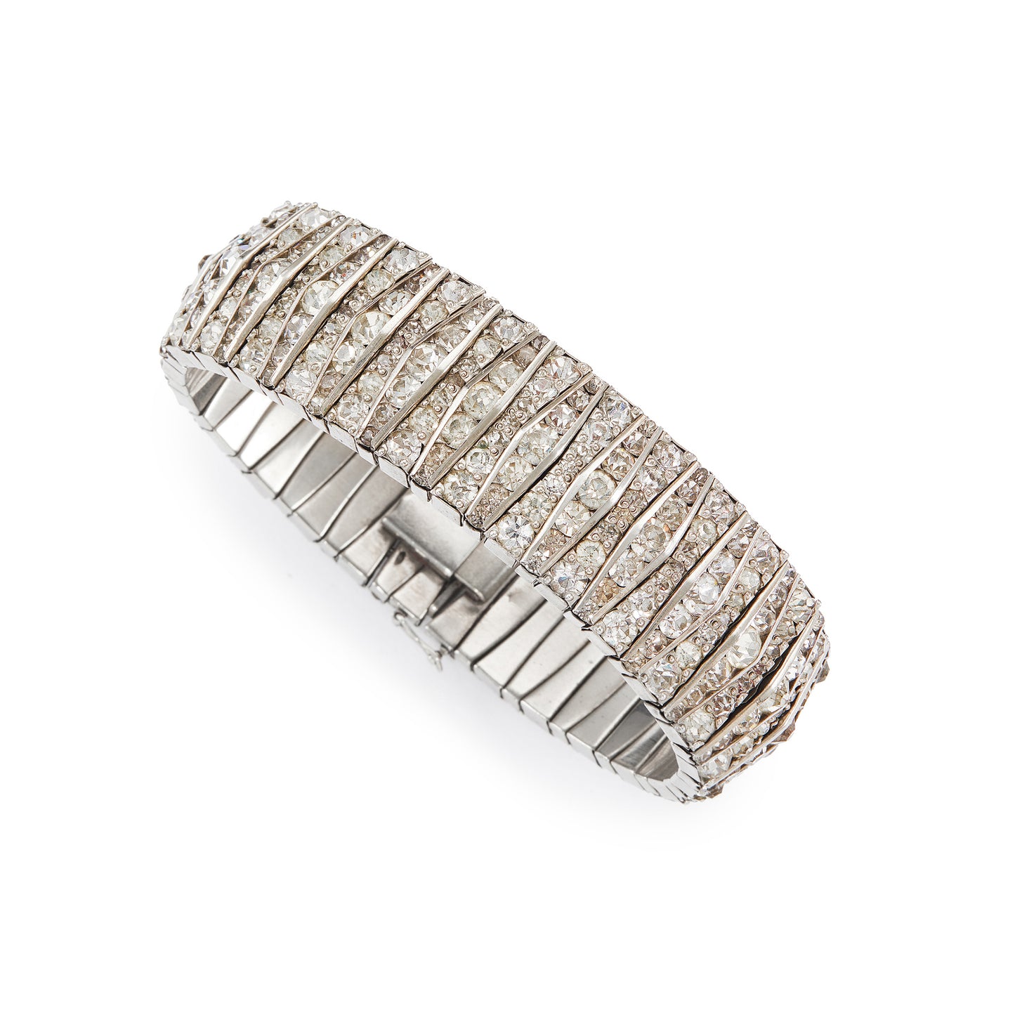 Glamorous articulated Art Deco metal bracelet set with an abundance of paste stones in varying shades of white.