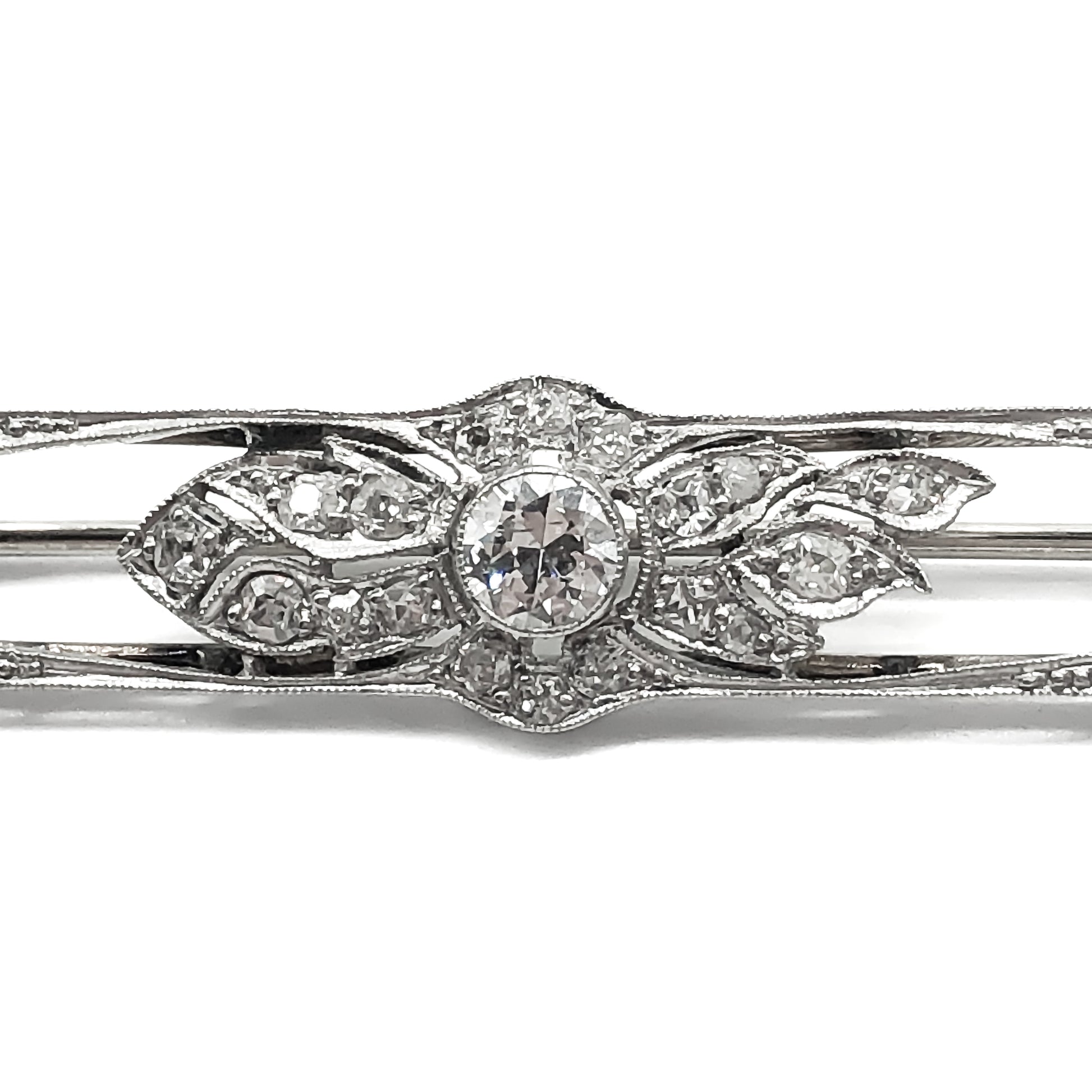 Classic art deco platinum diamond brooch with a 0.35ct centre diamond and forty two small old cut diamonds.