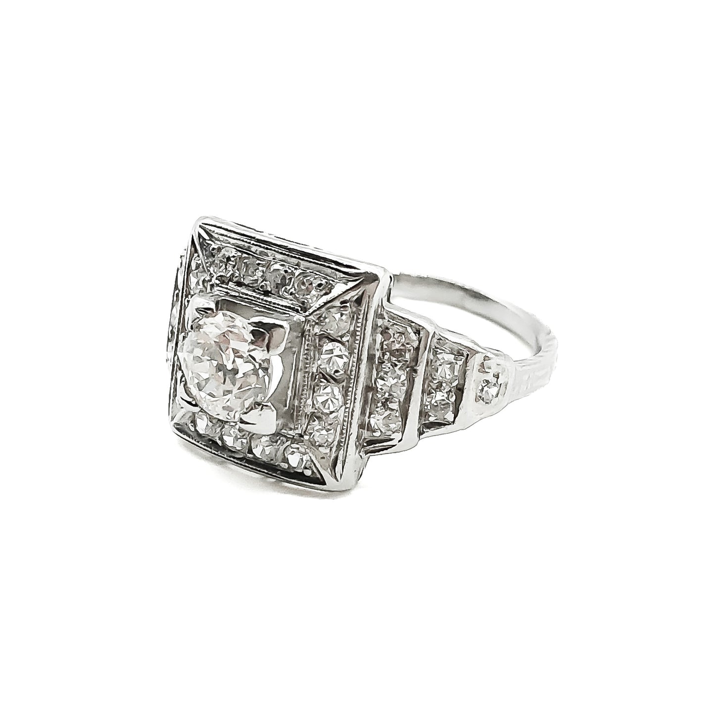 Stylish Art Deco platinum diamond ring set with a 0.50ct centre diamond, surrounded by twenty-eight smaller old-cut diamonds.