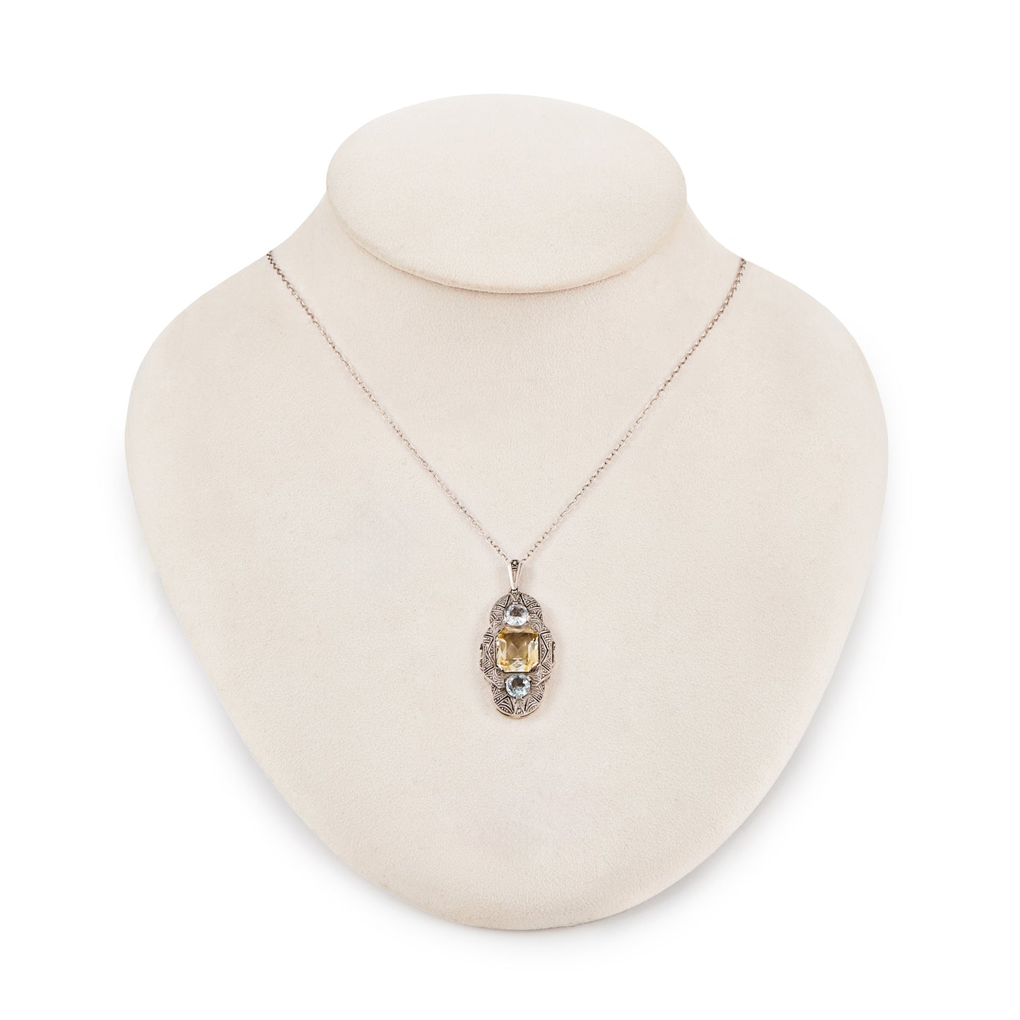 Lovely silver Art Deco Fahner-style pendant set with a single citrine and two faceted aquamarines, on a silver chain.