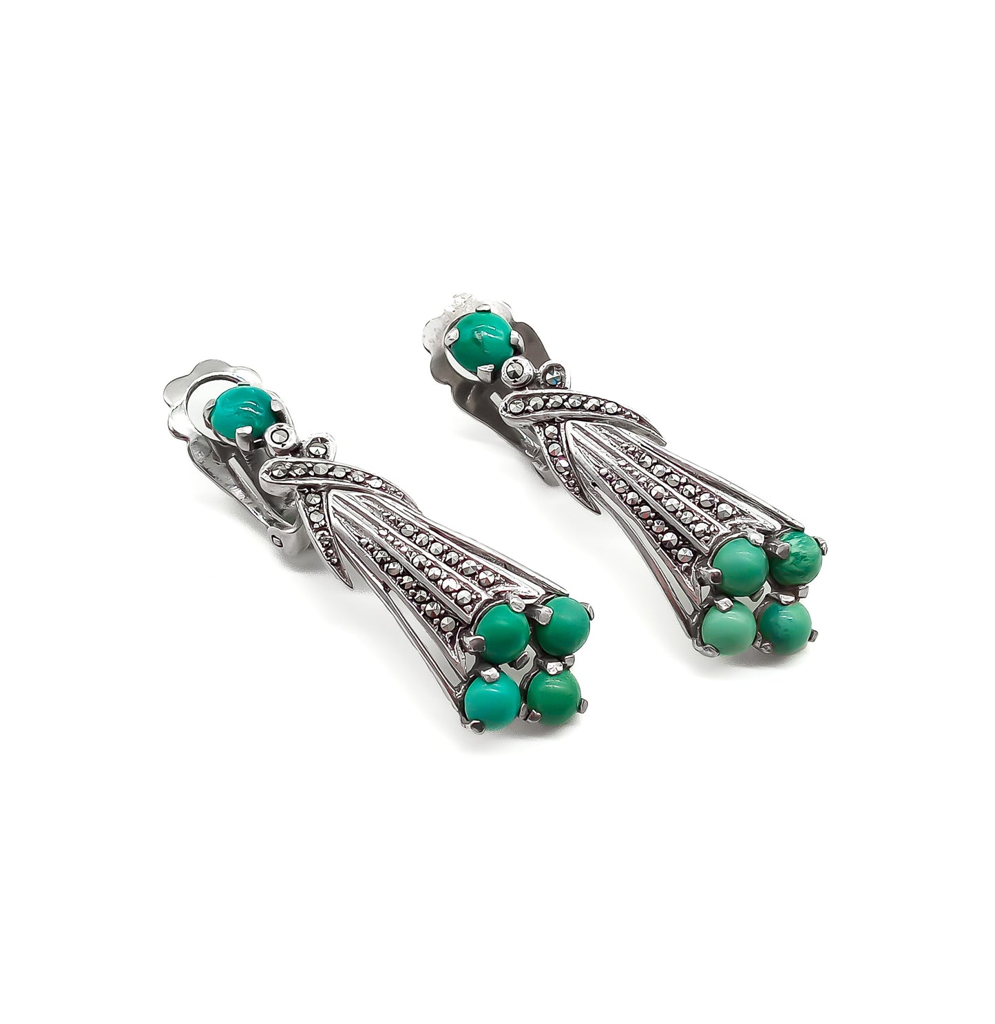 Glamorous Art Deco clip-on drop earrings set with cabochon turquoise stones and marcasites. Circa 1930’s