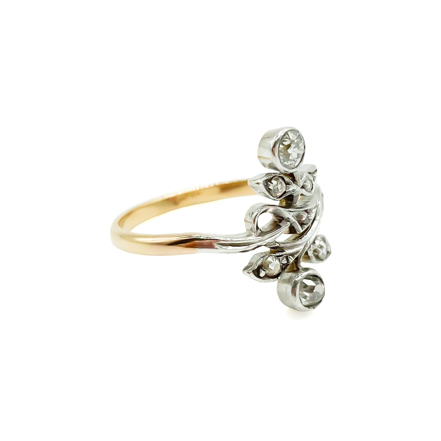 Gorgeous Art Nouveau ring set with seven old-cut diamonds in a floral design. Argentina