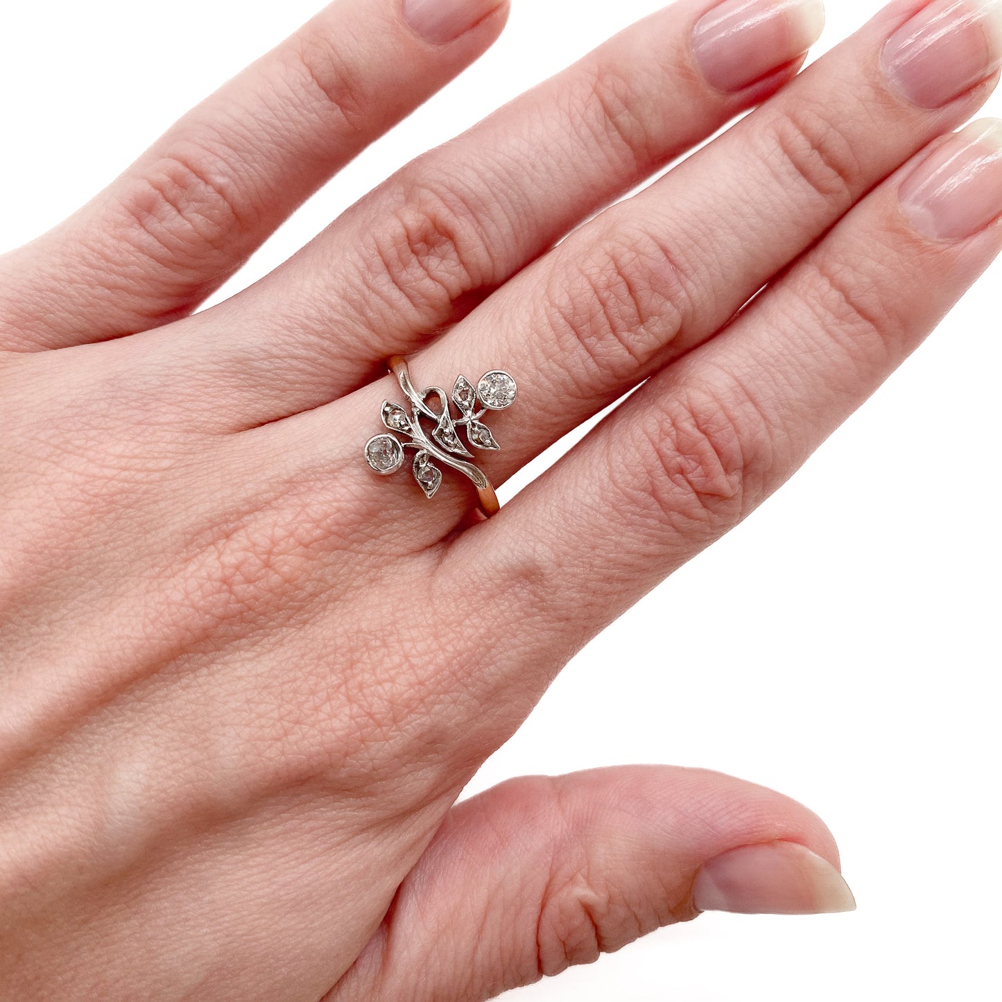 Gorgeous Art Nouveau ring set with seven old-cut diamonds in a floral design. Argentina