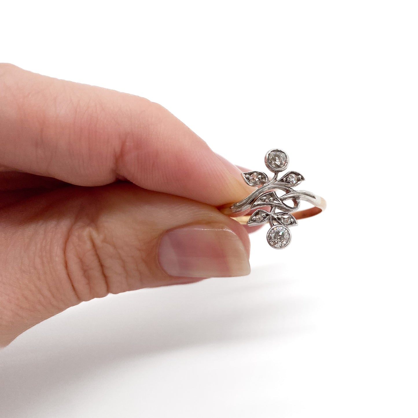 Gorgeous Art Nouveau ring set with seven old-cut diamonds in a floral design. Argentina