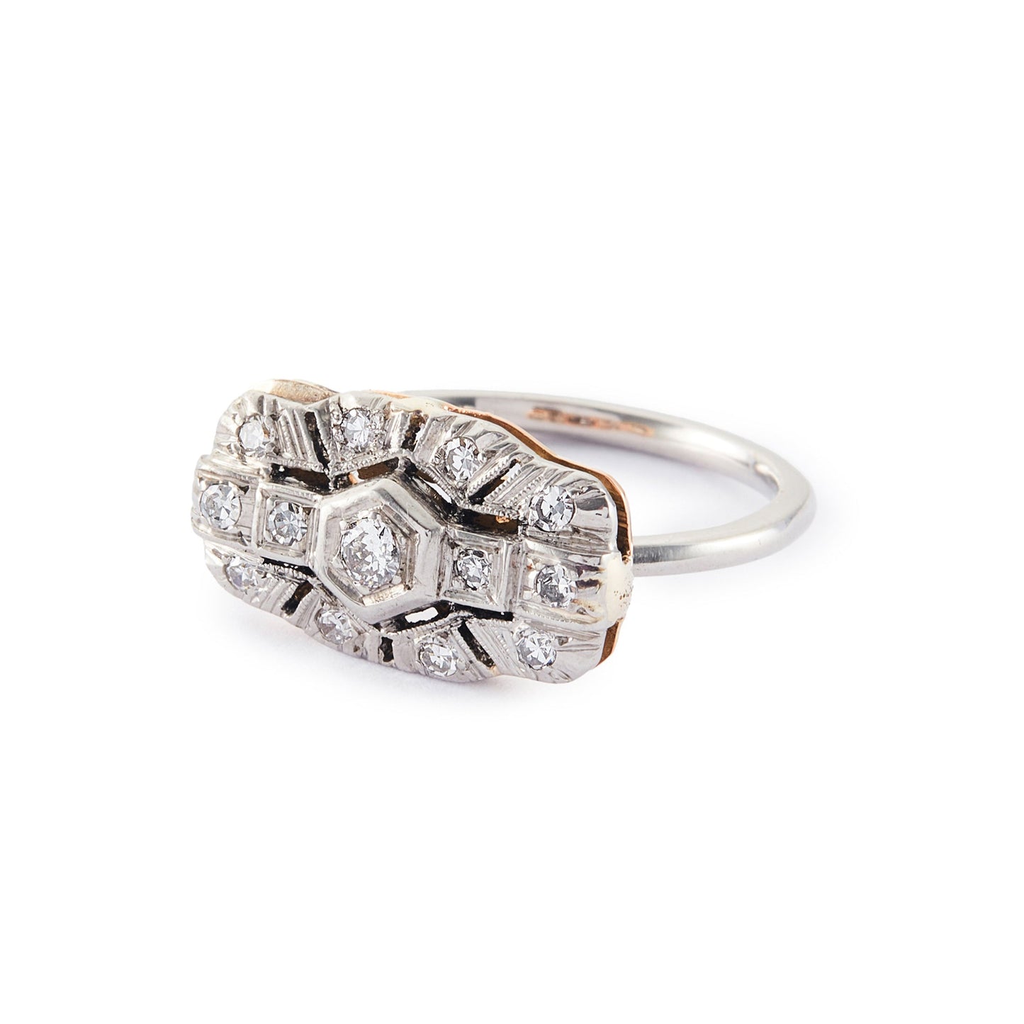 Beautiful Art Deco platinum and 18ct rose gold ring set with thirteen old-cut diamonds in an ornate setting.