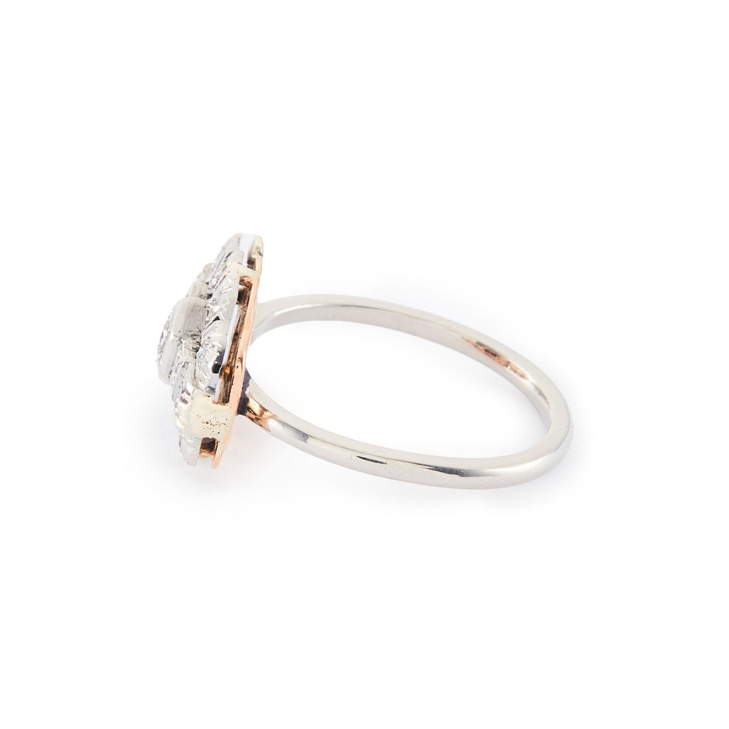 Beautiful Art Deco platinum and 18ct rose gold ring set with thirteen old-cut diamonds in an ornate setting.