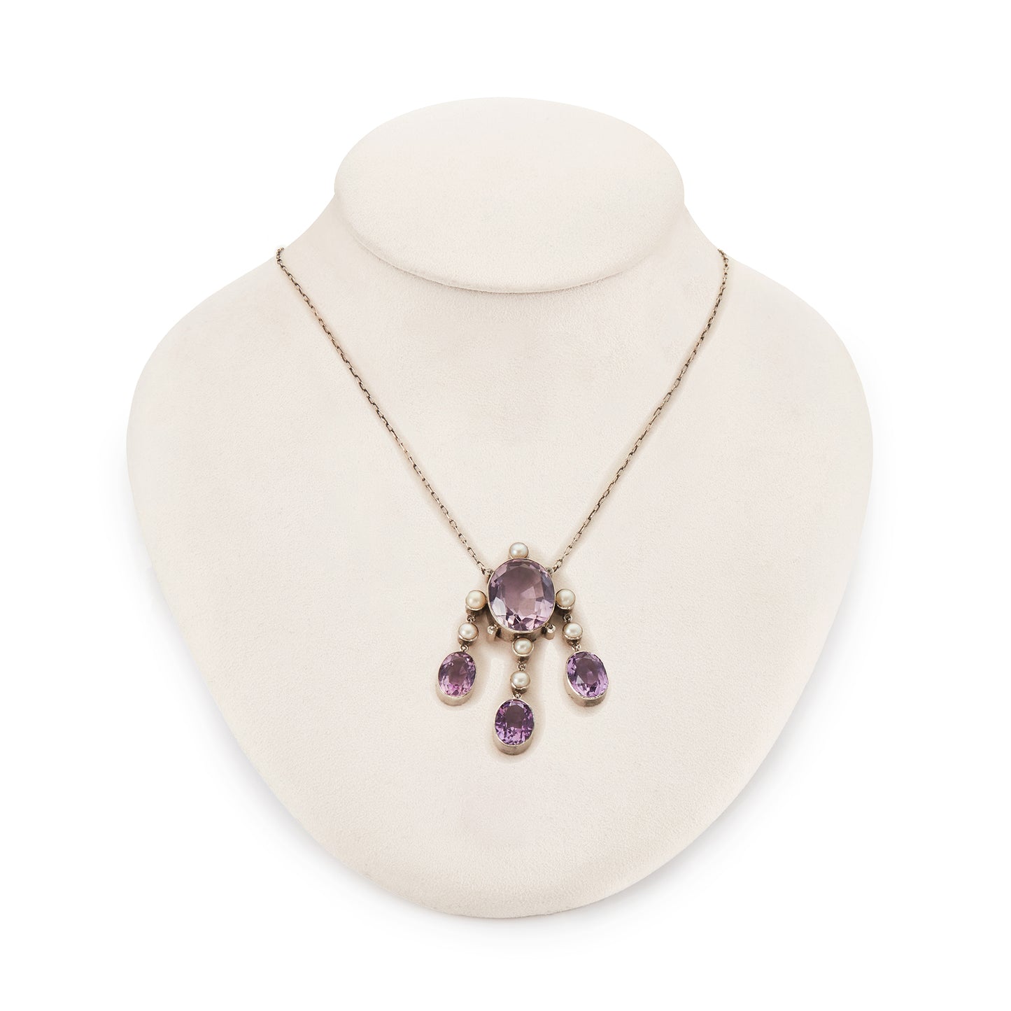 Beautiful Arts and Crafts silver necklace set with four chunky purple faceted amethysts, seven lustrous pearls and four tiny mine-cut diamonds. The necklace has a lovely toggle clasp.
