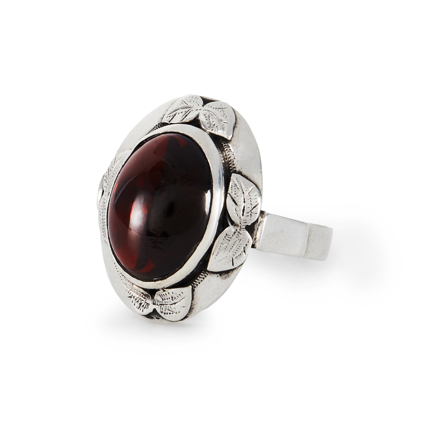 Lovely silver Arts and Crafts ring, set with a deep red oval cabochon garnet in an engraved leaf setting.