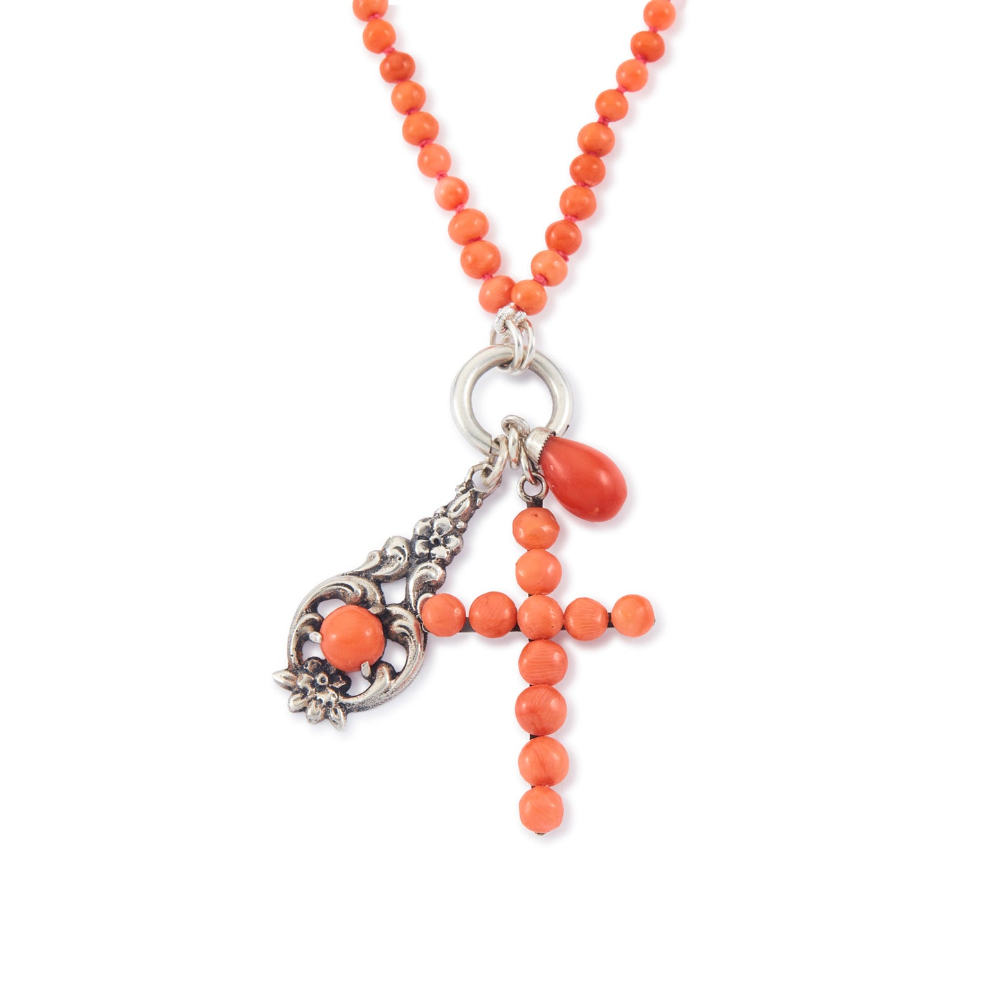 Quaint beaded natural coral necklace with three vintage silver and coral charms attached to a silver bolt ring.