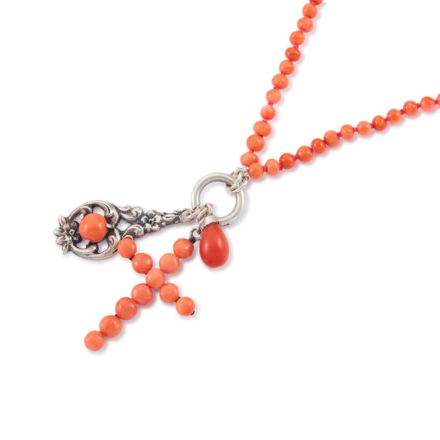 Quaint beaded natural coral necklace with three vintage silver and coral charms attached to a silver bolt ring.