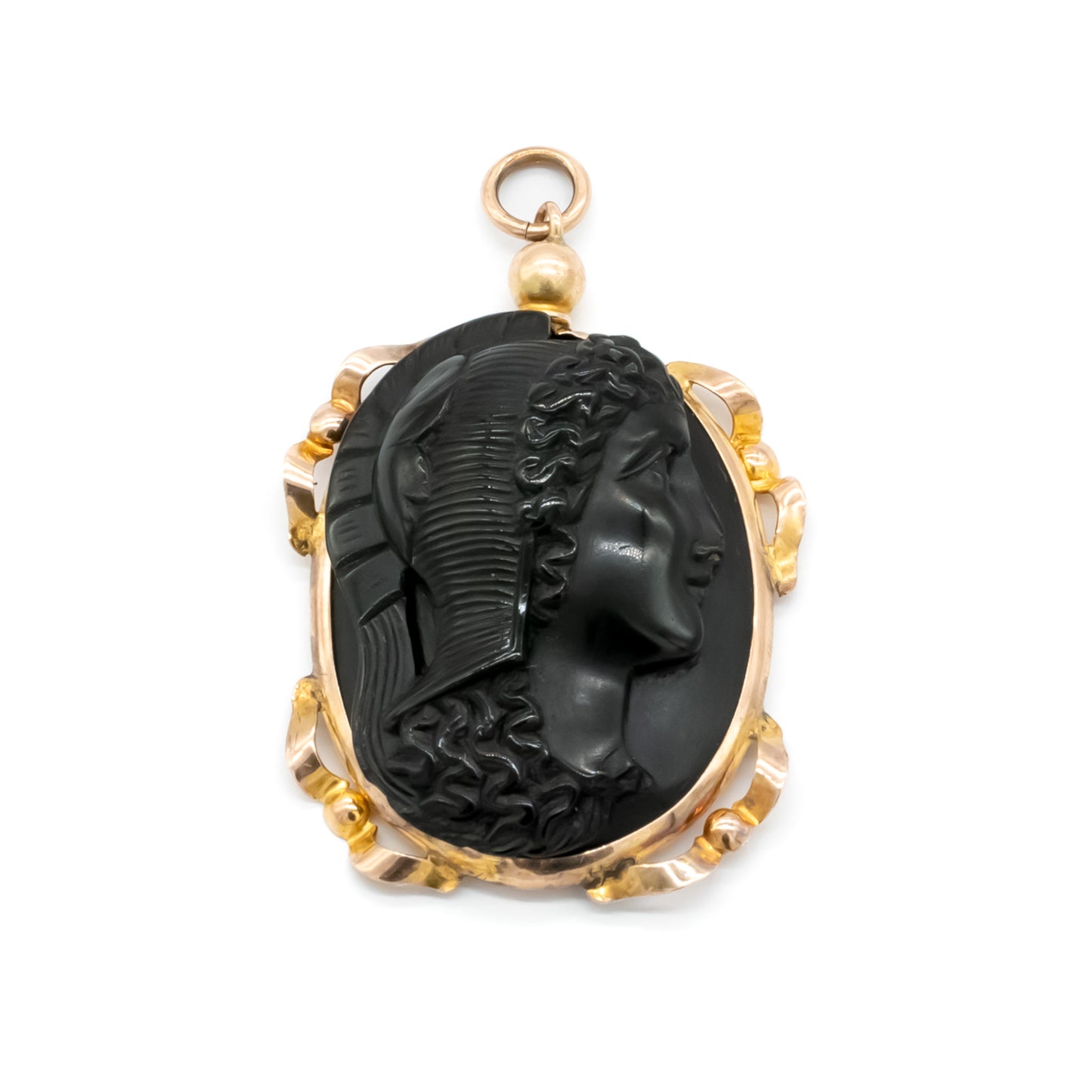 Lovely Victorian pendant set with a beautifully carved jet cameo depicting a classic roman head, with an ornate 9ct rose gold frame. London
