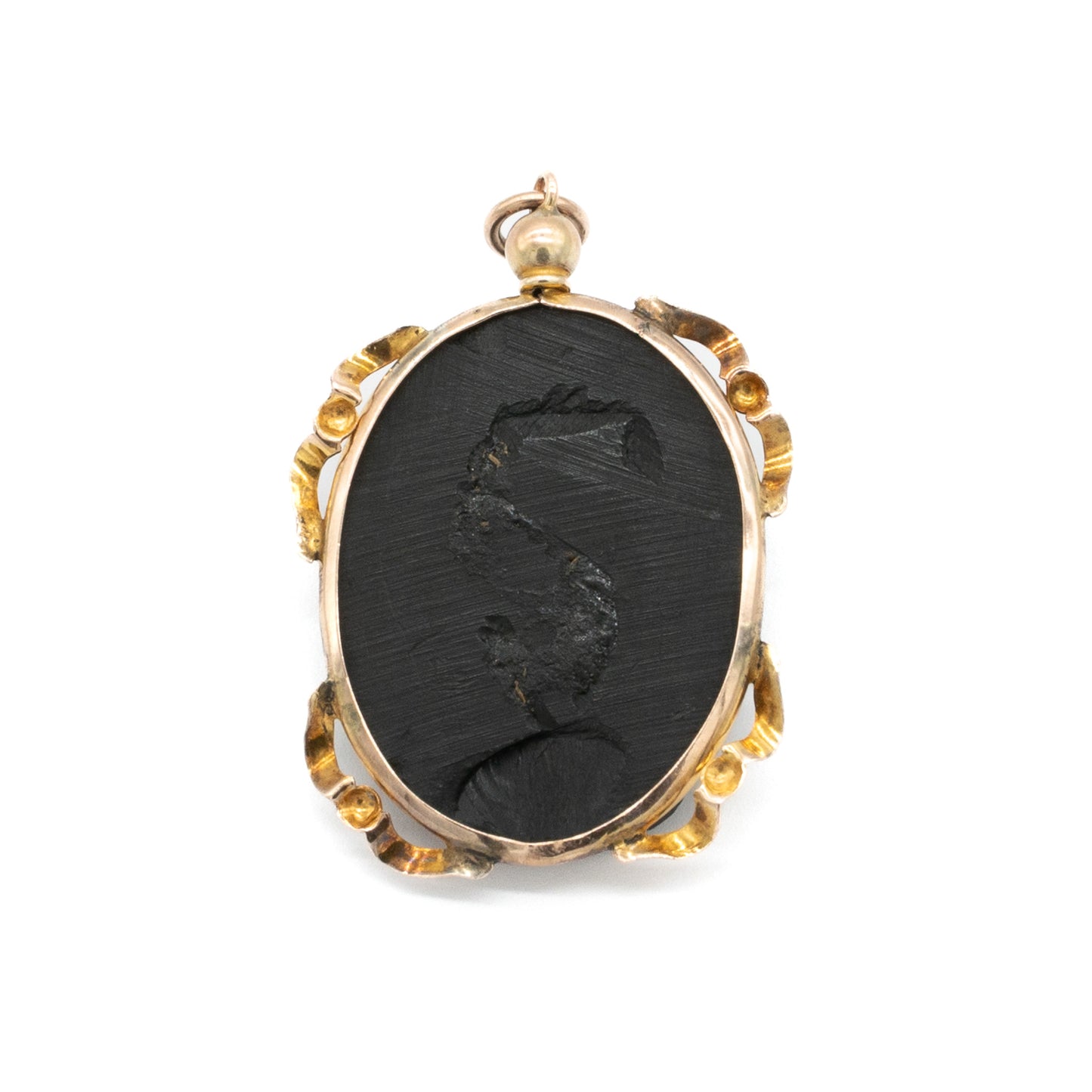 Lovely Victorian pendant set with a beautifully carved jet cameo depicting a classic roman head, with an ornate 9ct rose gold frame. London