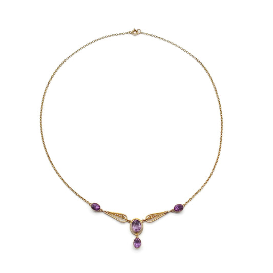 Gorgeous 15ct gold Edwardian necklace set with four beautifully faceted oval amethysts and eight small seed pearls.