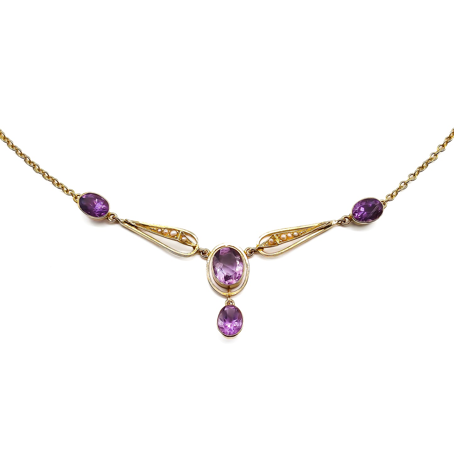 Gorgeous 15ct gold Edwardian necklace set with four beautifully faceted oval amethysts and eight small seed pearls.