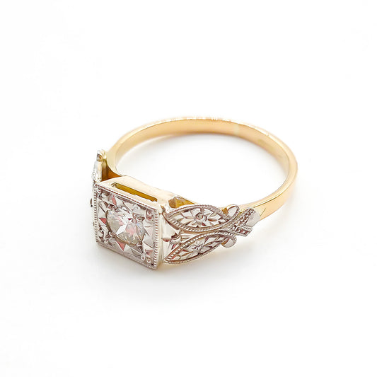 Beautifully engraved Edwardian white and yellow gold ring set with a sparkling 0.35ct old-European-cut centre diamond.