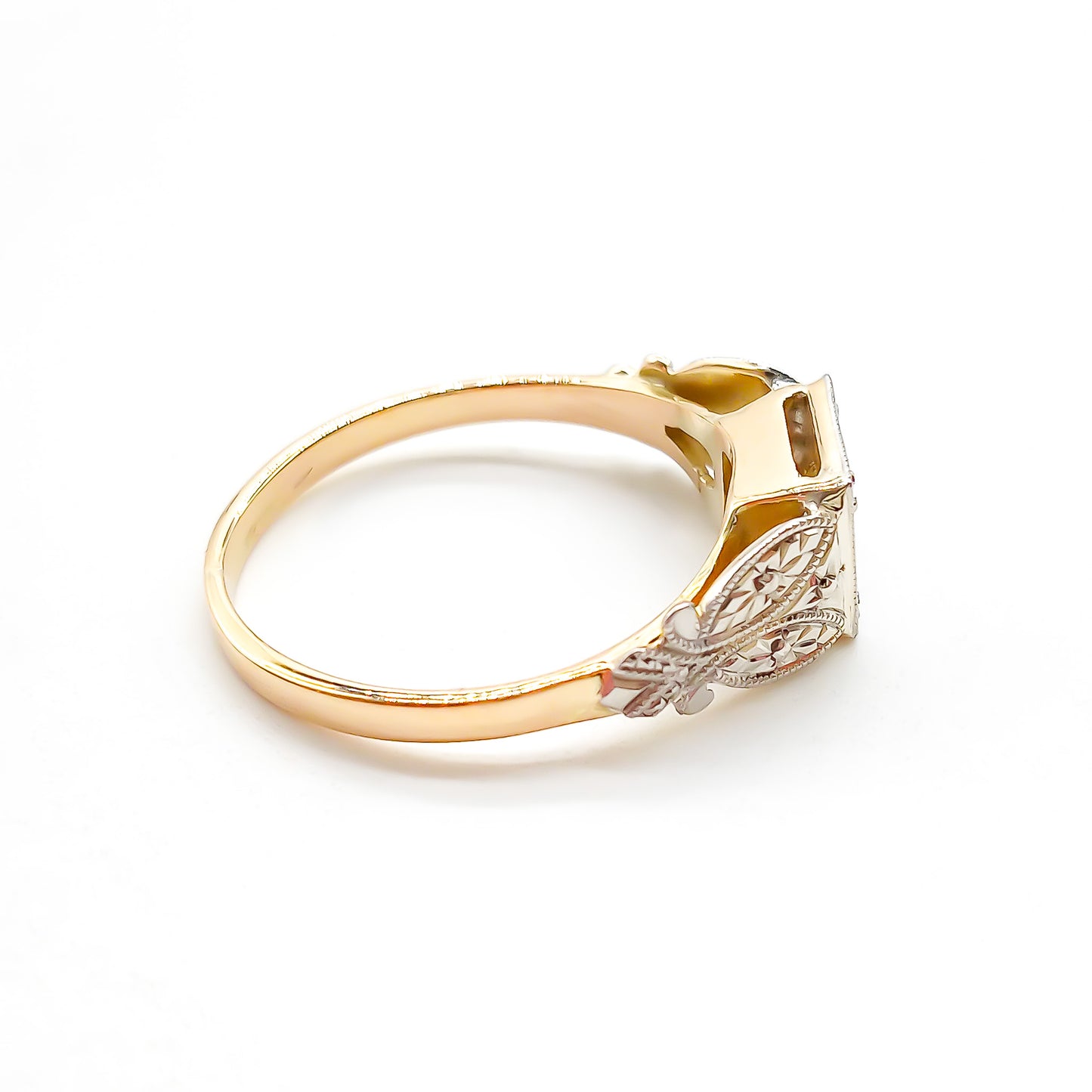 Beautifully engraved Edwardian white and yellow gold ring set with a sparkling 0.35ct old-European-cut centre diamond.