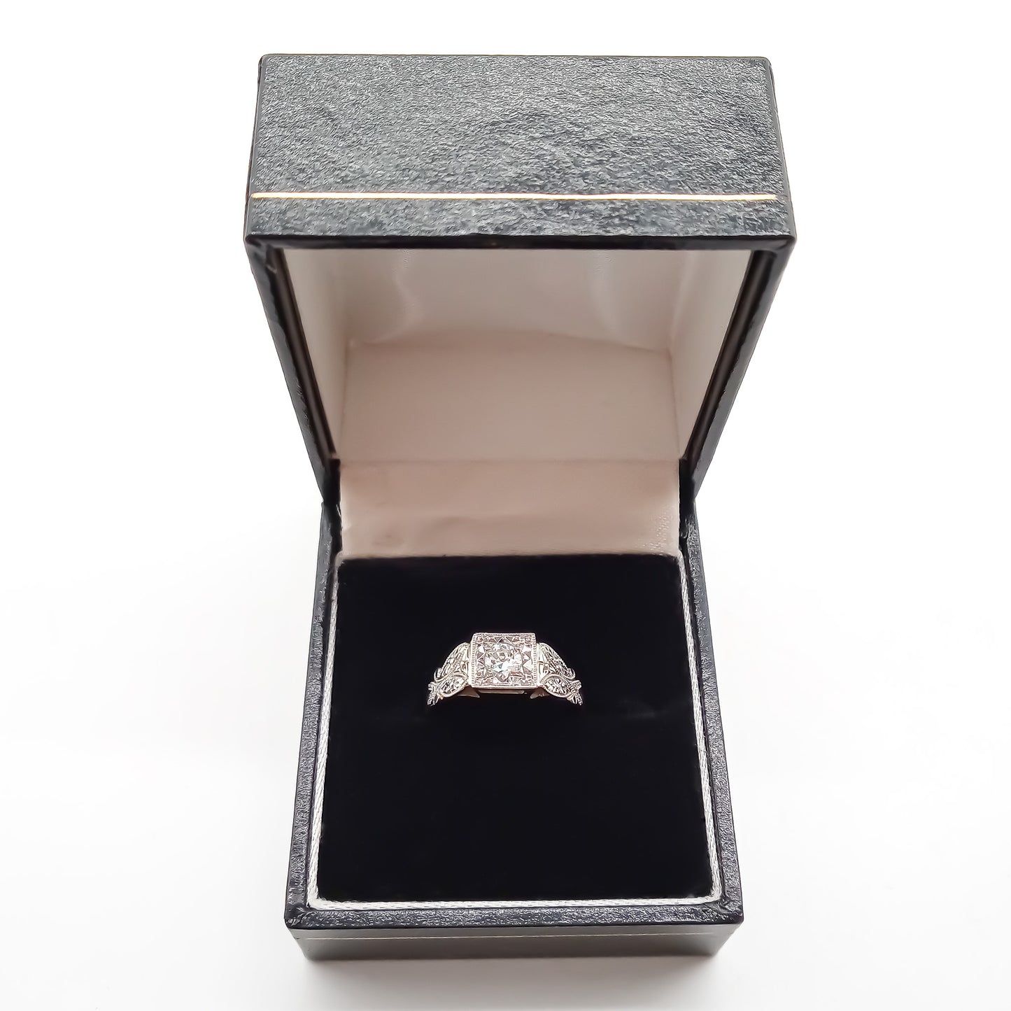 Beautifully engraved Edwardian white and yellow gold ring set with a sparkling 0.35ct old-European-cut centre diamond.
