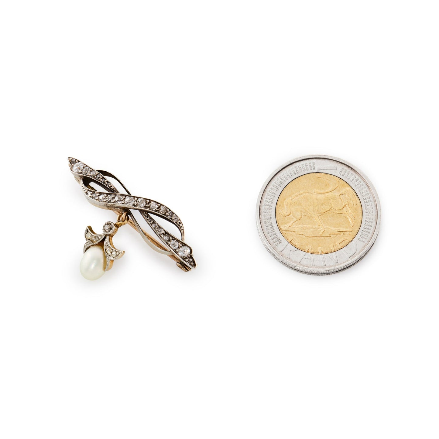 Exquisite Edwardian 18ct gold and silver bow brooch encrusted with old cut diamonds in varying sizes, with a pearl and diamond drop.