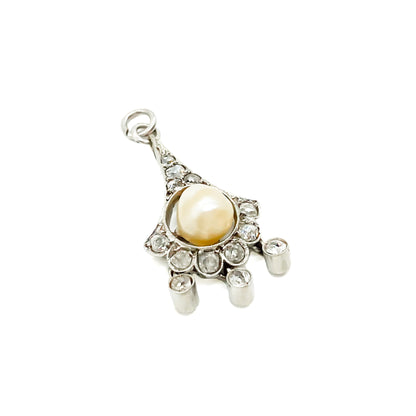Charming Edwardian 18ct white gold pendant set with a centre pearl surrounded by ten old-cut diamonds, and three dangling diamond drops.