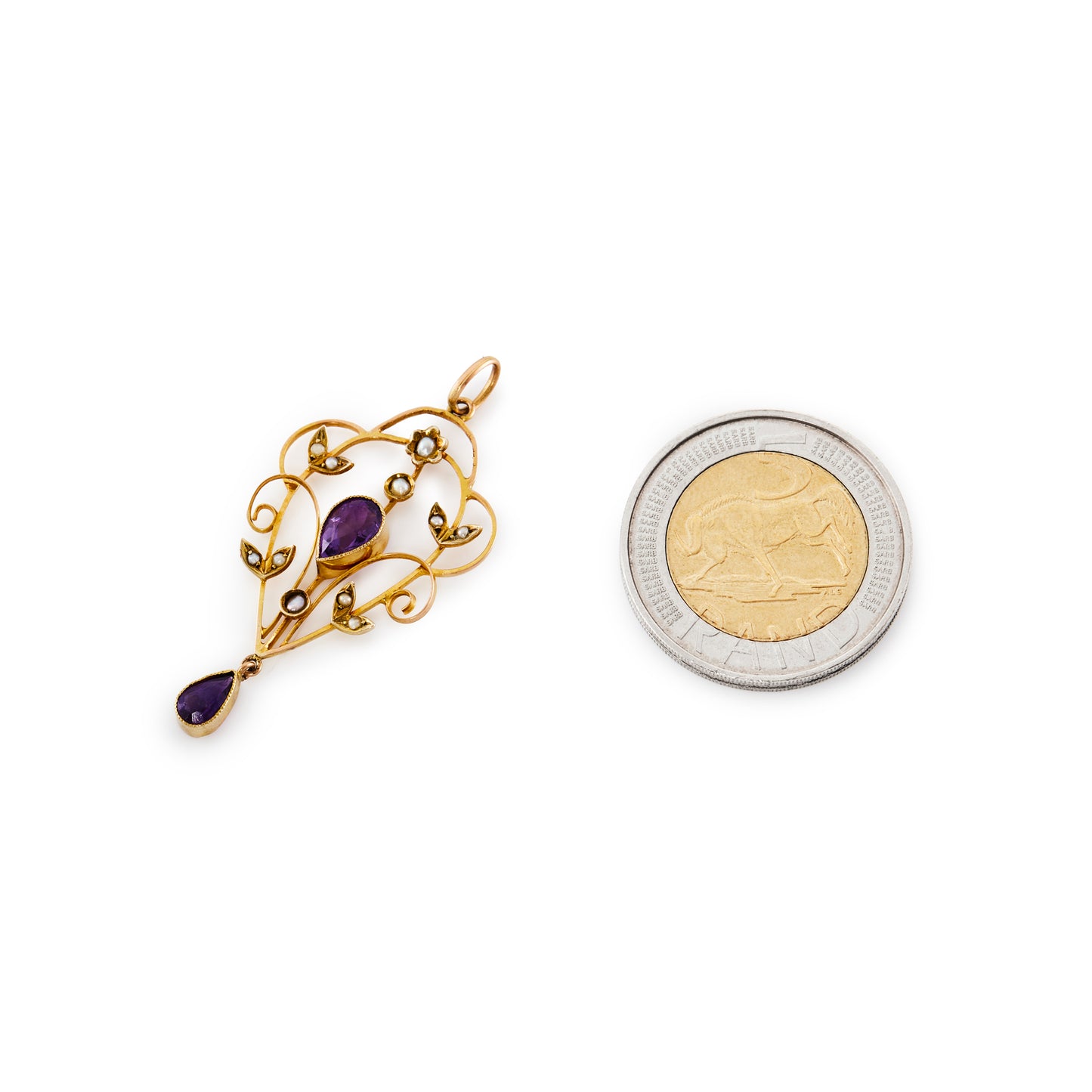 Pretty Edwardian 9ct gold pendant set with two beautifully faceted pear-shaped amethysts and eleven tiny seed pearls.
