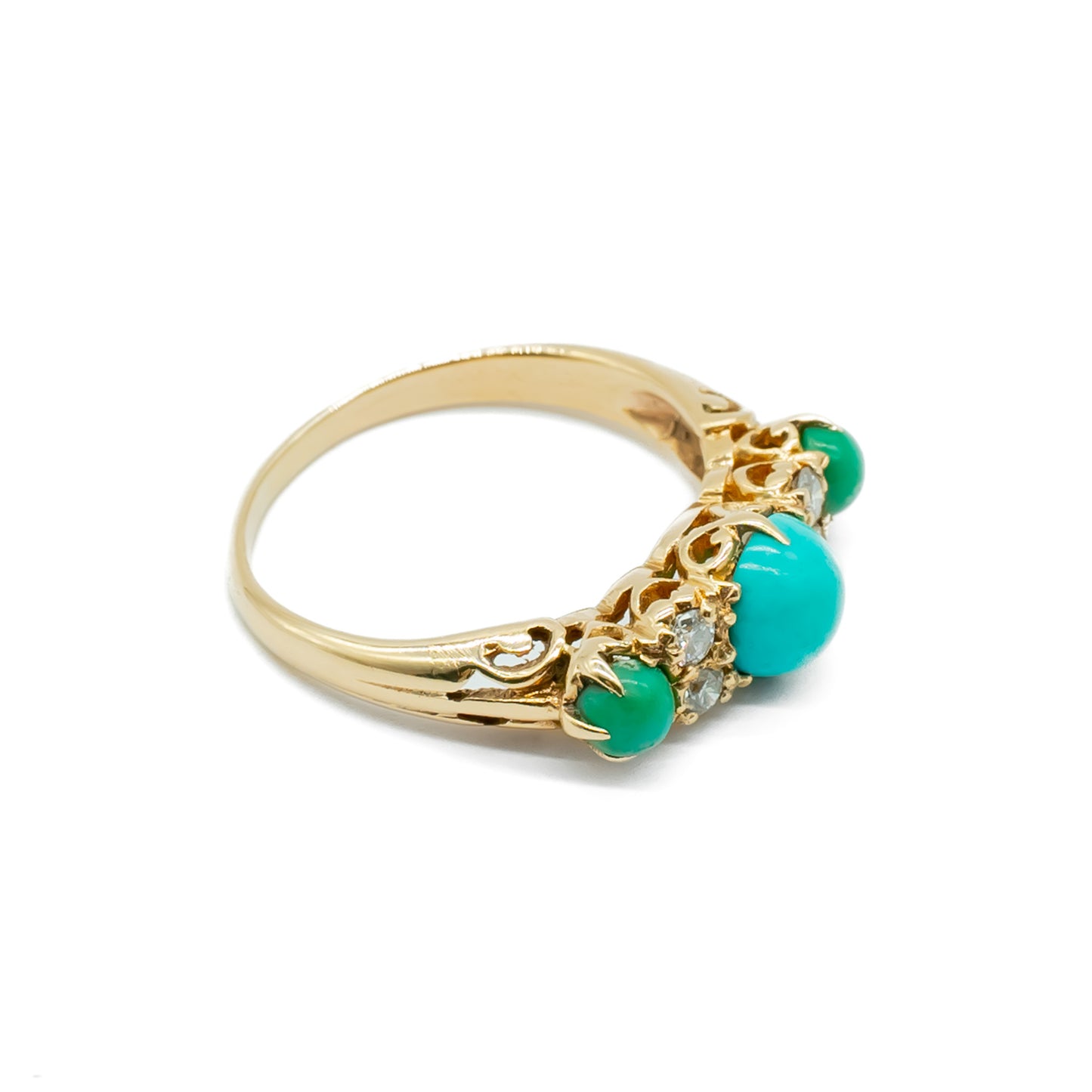 Beautiful Edwardian 9ct gold ring set with three cabochon turquoise stones and four faceted diamonds.