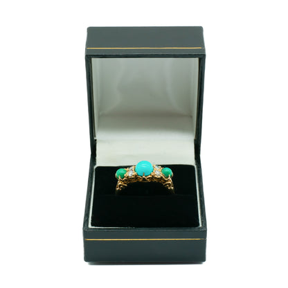 Beautiful Edwardian 9ct gold ring set with three cabochon turquoise stones and four faceted diamonds.