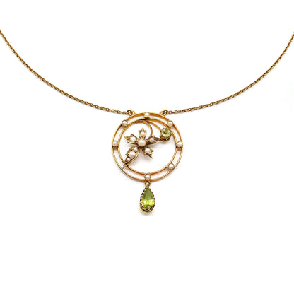 Charming Edwardian 9ct gold seed pearl and peridot pendant attached to 9ct gold chain.
